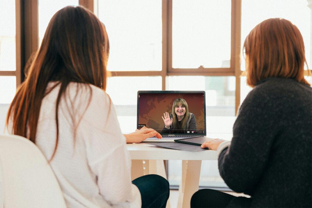 2 women watching conference